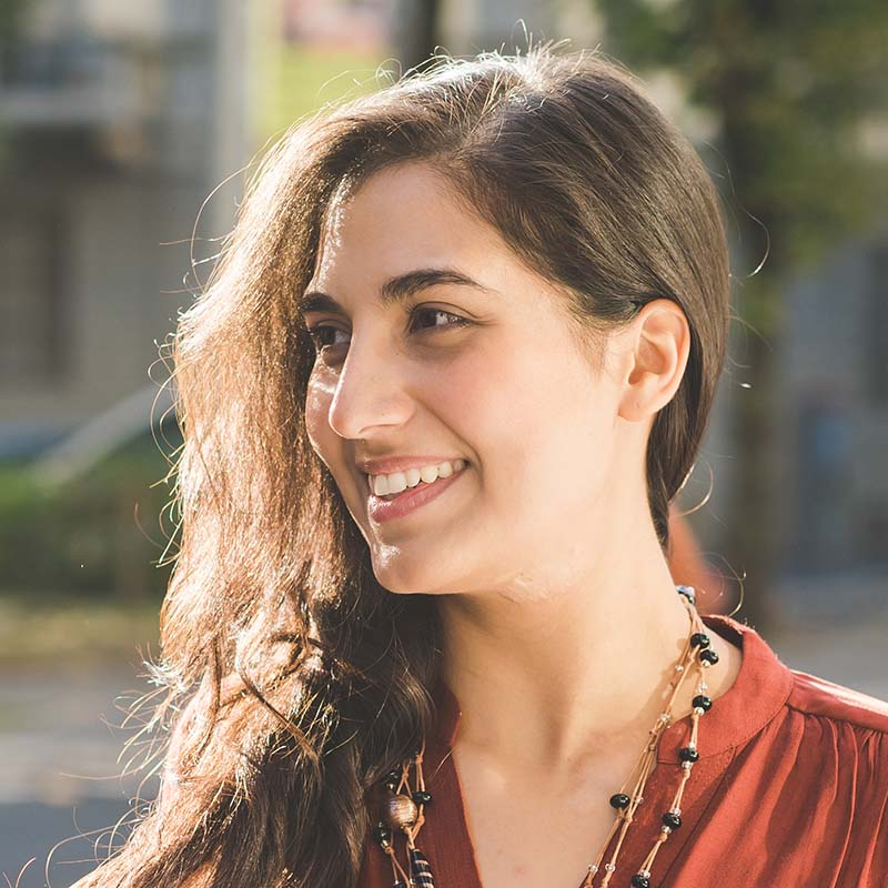 Portrait young brunette woman outdoor overlooking vc59nus.jpg
